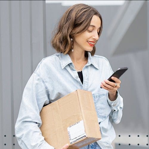 Women holding package and phone